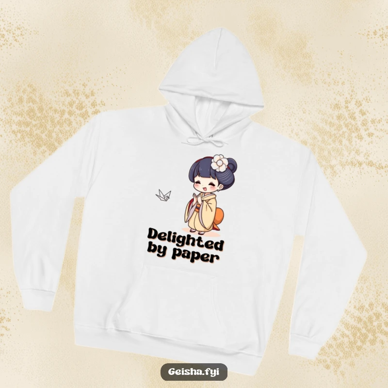 Funny Geisha clapping gleefully at a tiny paper crane, cozy and humorous hoodie.
