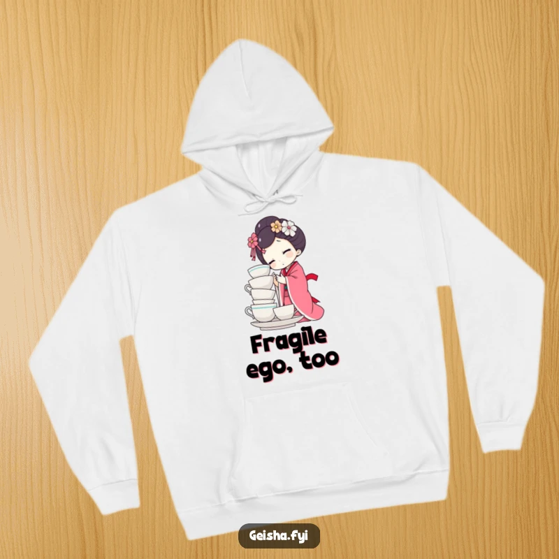 Funny geisha doll hoodie character precariously balancing a tower of teacups, looking stressed. A humorous, cozy apparel choice.